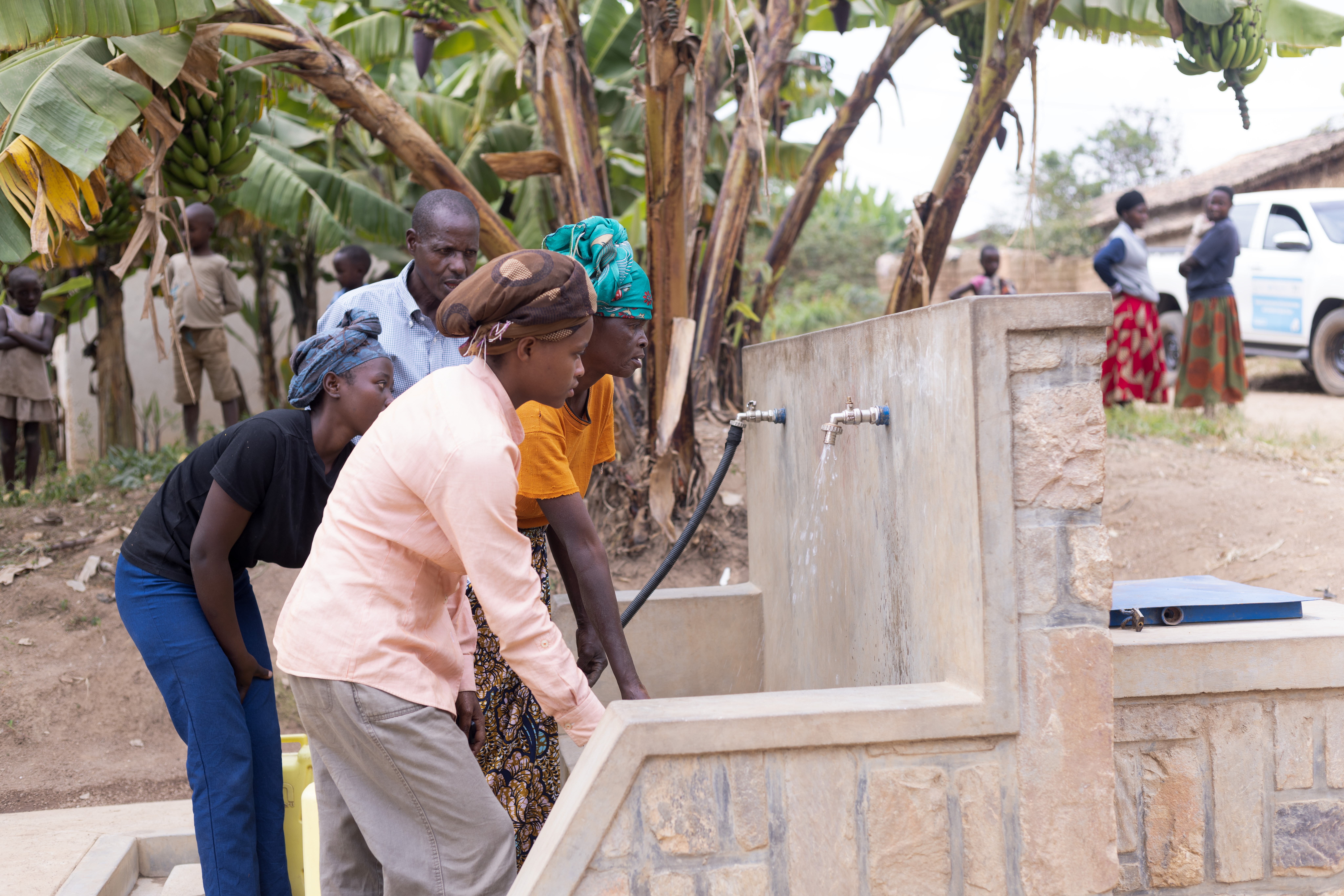 Residents of Kinihira Sector fetch clean water from a public water point established under the Nkomero–Kinihira Water Supply System